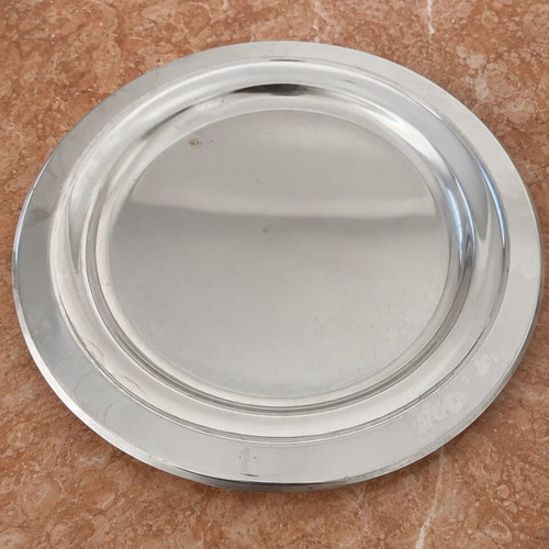 Metal serving bowl with gold handles