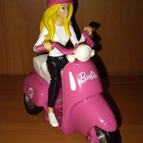 Barbie figure on motorcycle used with motion