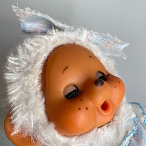 El Greco vintage white monkey plush toy in dress