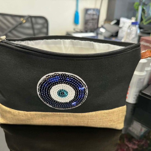 Black clutch bag with blue eye and leather strap new