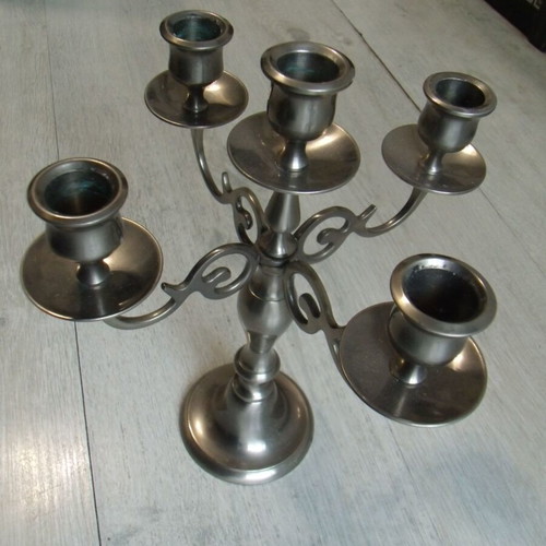 Old metal candlestick with five holders used