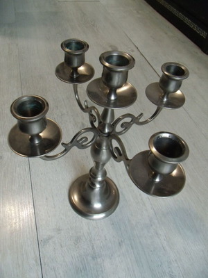 Old metal candlestick with five holders used