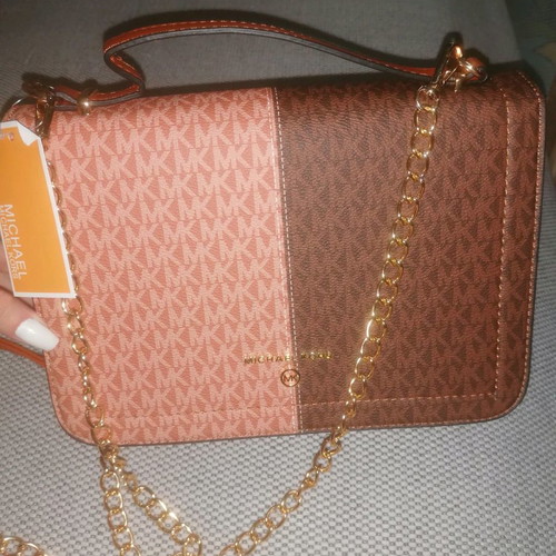 Shoulder bag used with strap for shoulder and hand
