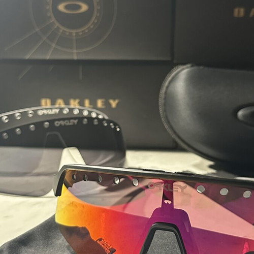Oakley Sutro sunglasses new with two lenses black and red