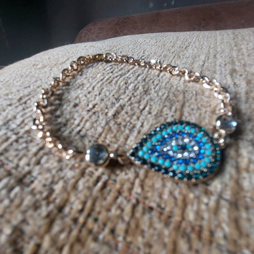Gold bracelet new with eye and blue, turquoise, white stones
