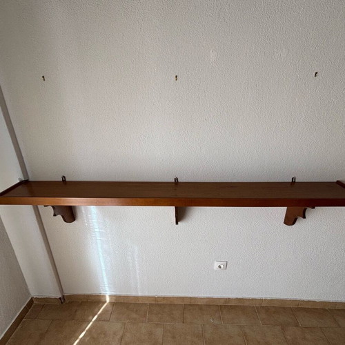 Wooden wall shelf with decorative supports like new