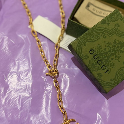 Gucci gold necklace with large GG pendant and chain, new