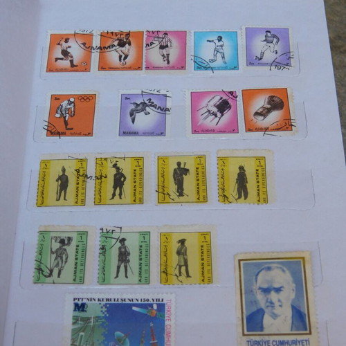 Red album with worldwide collectible stamps