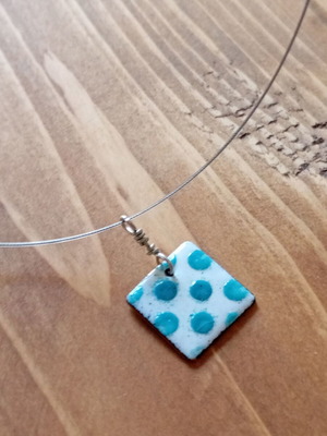 Necklace new with square embossed design and green details