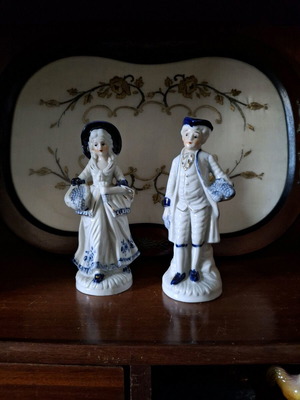 Porcelain vintage figurines used, girl and boy with grape baskets