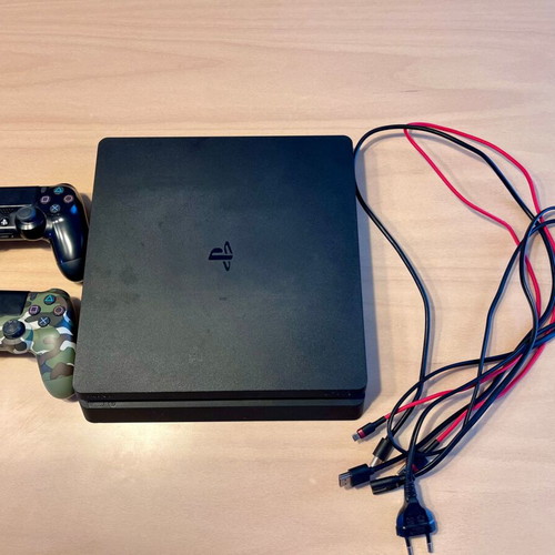 PS4 Slim 500GB console with 2 DualShock 4 controllers and Chimparty game
