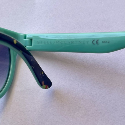 Stella McCartney Kids Sunglasses used, turquoise frame with colorful design