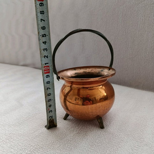 Vintage German copper vessel used with twisted handle and brass legs