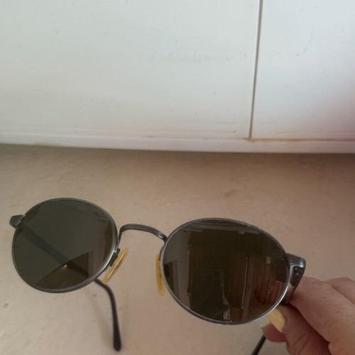 Luxottica vintage sunglasses with scratch-resistant lenses and case used