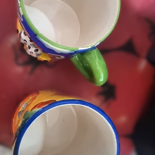 Decorative ceramic mugs set of 2 with embossed animal designs like new