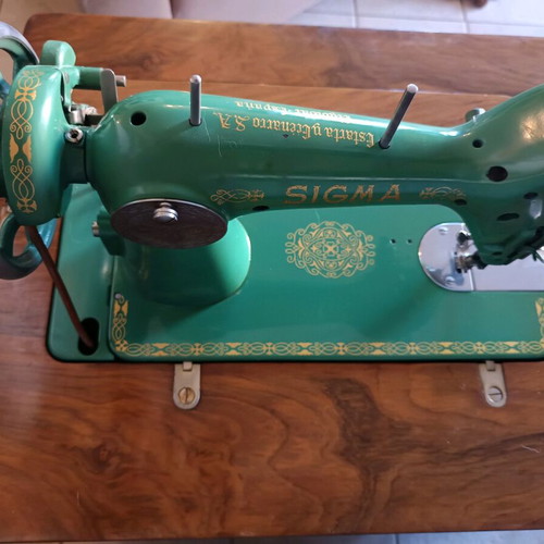 Sigma sewing machine used with wooden cabinet and bar door