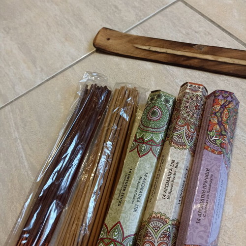 Aromatic incense sticks with wooden base, assorted scents