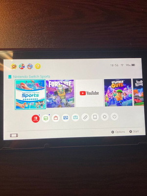Nintendo Switch like new with 4 controllers and glass case