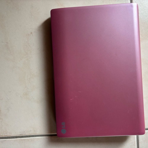 LG laptop like new without charger with pink cover and scratches