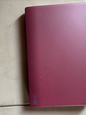 LG laptop like new without charger with pink cover and scratches