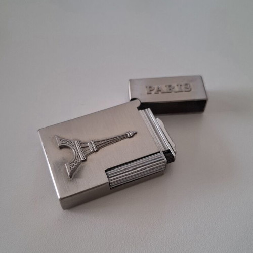 Gas lighter with Eiffel Tower design, like new
