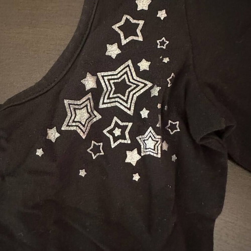 Demix black dance leotard with long sleeves and stars like new, size 128