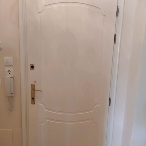 Lacquered entrance door used, terracotta exterior, white interior