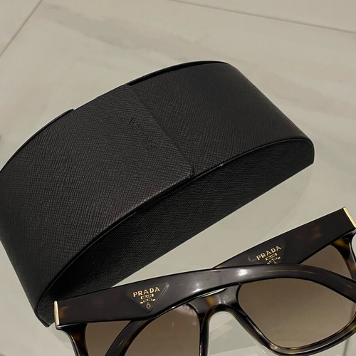 Prada SPR 24Q sunglasses used, brown tortoise design with case