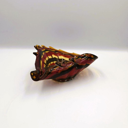Glass ashtray used red with shell design