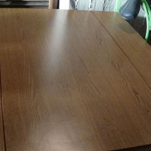 Wooden dining table used with extension