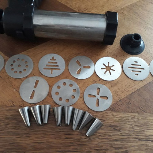 Biscuit press set used with 8 pastry nozzles and 10 dough designs