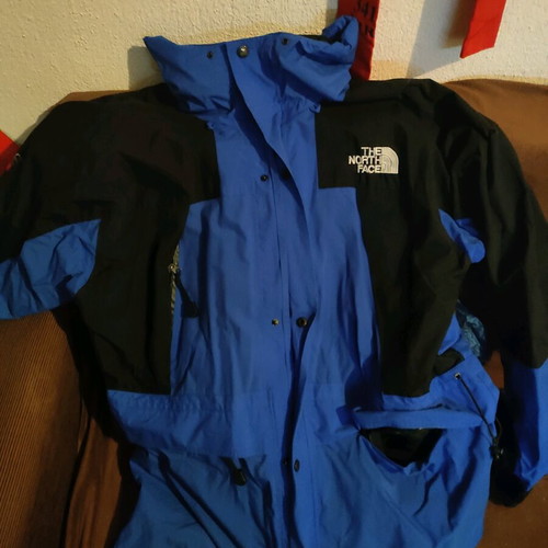 The North Face men's jacket used blue and black waterproof windbreaker