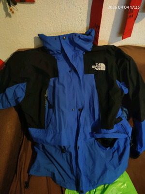 The North Face men's jacket used blue and black waterproof windbreaker