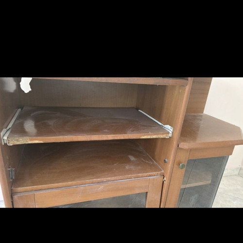 Wooden TV unit with glass doors used, storage space