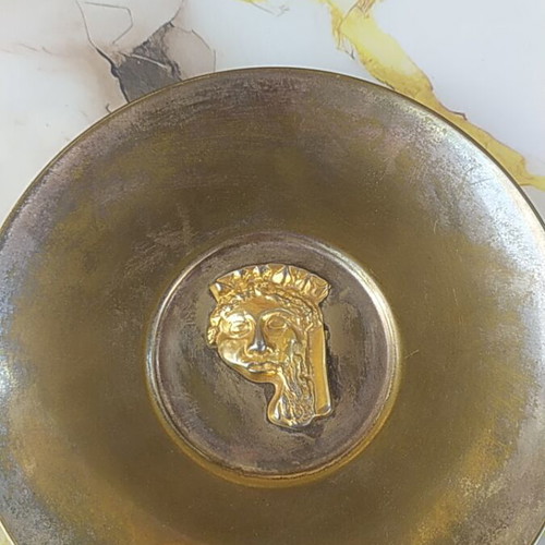 Decorative plate, possibly brass