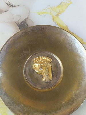 Decorative plate, possibly brass
