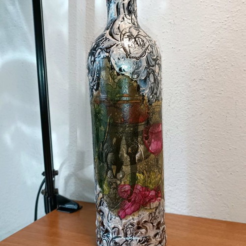 Painted wine bottle used for design