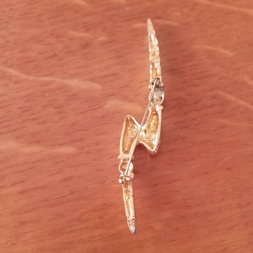 Vintage lightning bolt brooch with red stones, like new