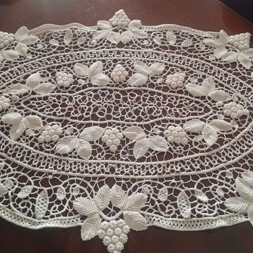 Antique handmade crochet table linen with grape cluster design used