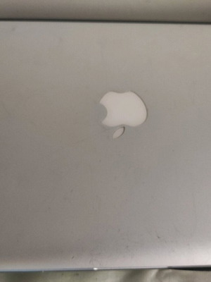 Mac book pro used with cracked mouse pad and without charger