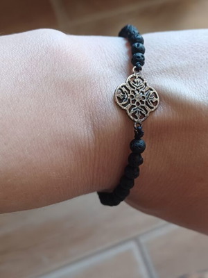 Handmade bracelet with black natural lava beads and clover motif like new