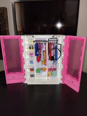 Barbie wardrobe and bicycle with 2 helmets
