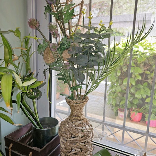 Decorative vase like new with artificial plants and flowers boho style