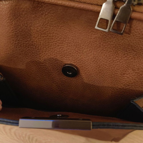 Brown backpack like new with leather texture and two compartments