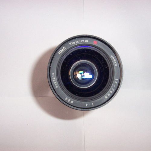 Canon T50 SLR analog camera used with two zoom lenses and flash