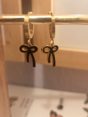 Steel hoop earrings with black bow like new