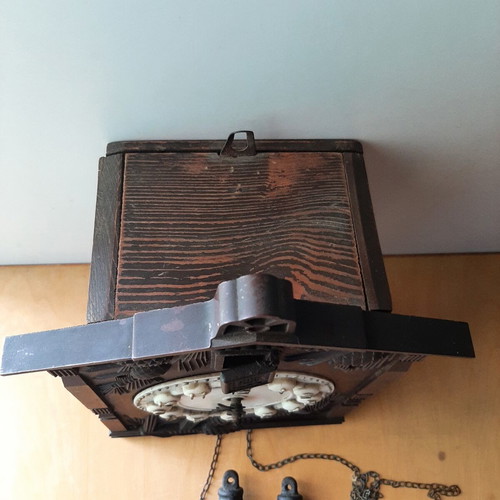 Vintage cuckoo clock used with pinecone weights