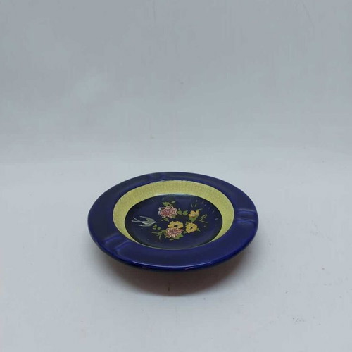 Porcelain ashtray used, blue shade with flowers and yellow details
