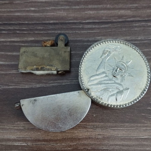 Collectible lighter used with John F. Kennedy and Statue of Liberty design