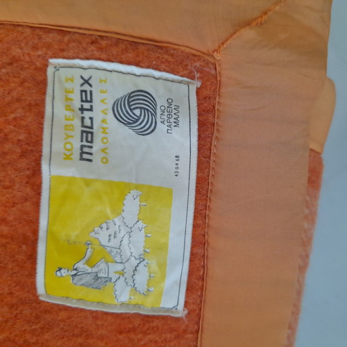 Wool blanket used, orange checkered bicolor